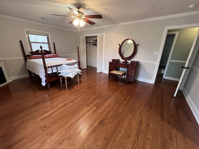 bedroom with crown molding, baseboards, and wood finished floors