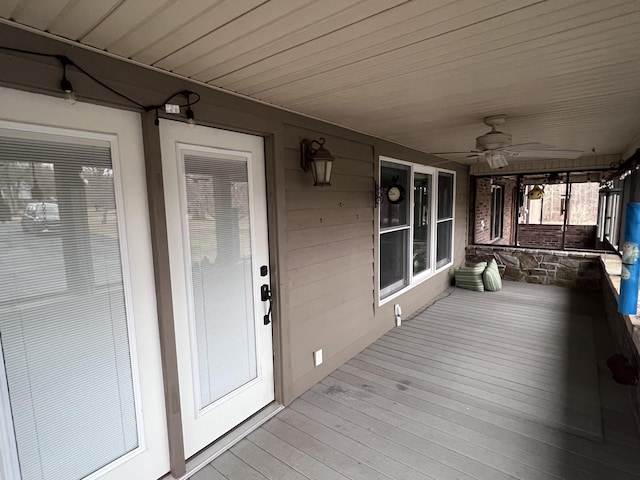 deck with a porch and a ceiling fan