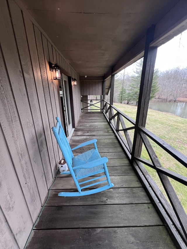 deck featuring a water view