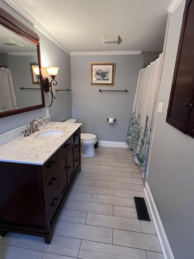 full bathroom with visible vents, crown molding, vanity, and baseboards