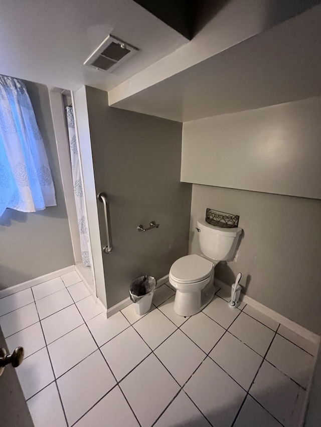 full bathroom with toilet, tile patterned floors, visible vents, baseboards, and a shower with curtain