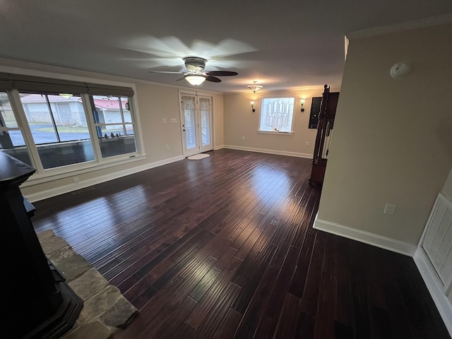 unfurnished living room with visible vents, baseboards, dark wood finished floors, ceiling fan, and french doors