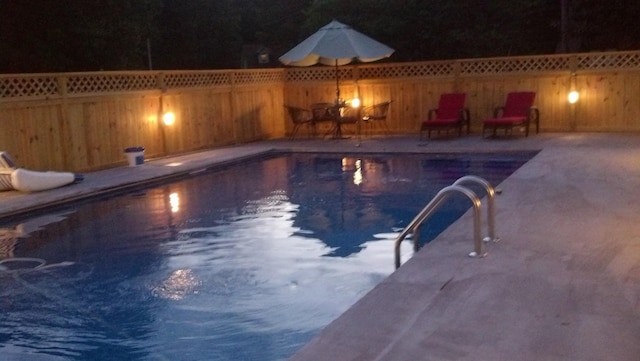 view of pool featuring a fenced in pool, a fenced backyard, and a patio