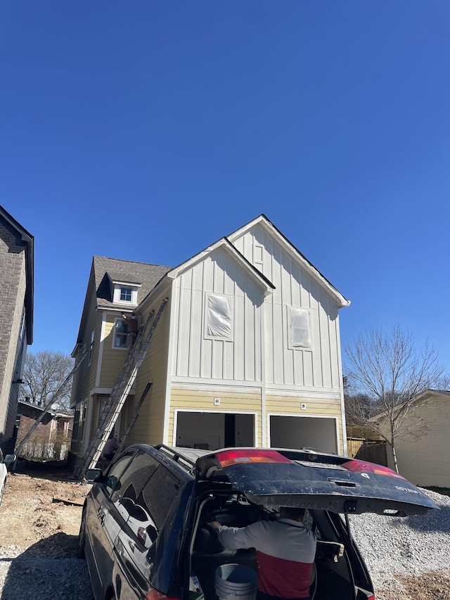 view of front facade featuring an attached garage and board and batten siding