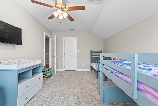 carpeted bedroom with lofted ceiling, baseboards, visible vents, and a ceiling fan