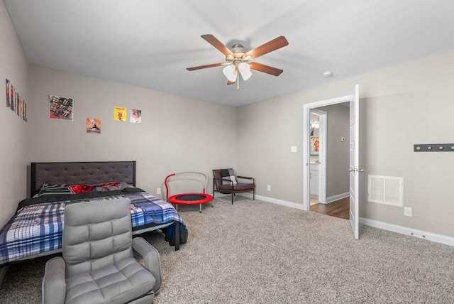 bedroom featuring carpet floors, a ceiling fan, visible vents, and baseboards