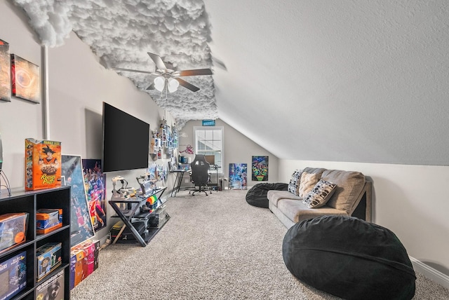 carpeted living area with a ceiling fan, lofted ceiling, and a textured ceiling