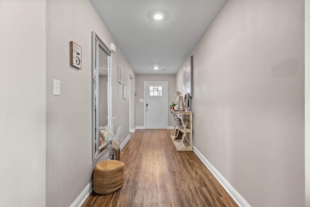 entryway featuring wood finished floors and baseboards