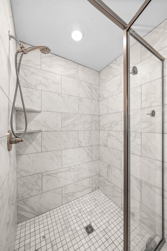 full bathroom featuring a shower stall