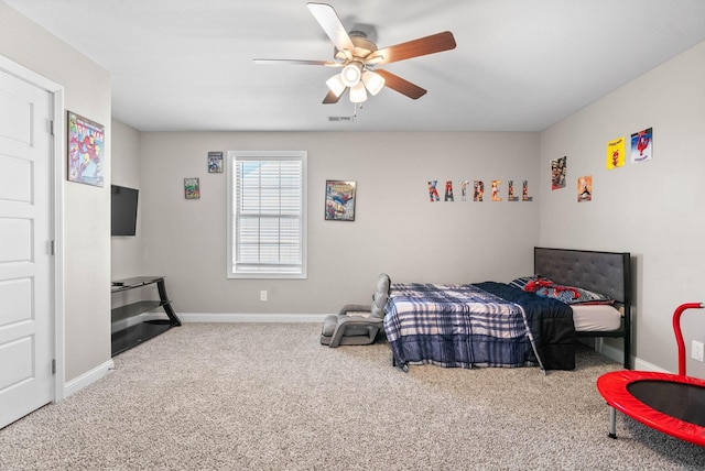 bedroom featuring carpet floors, visible vents, baseboards, and a ceiling fan