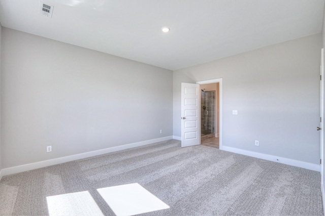 spare room with recessed lighting, visible vents, baseboards, and light colored carpet