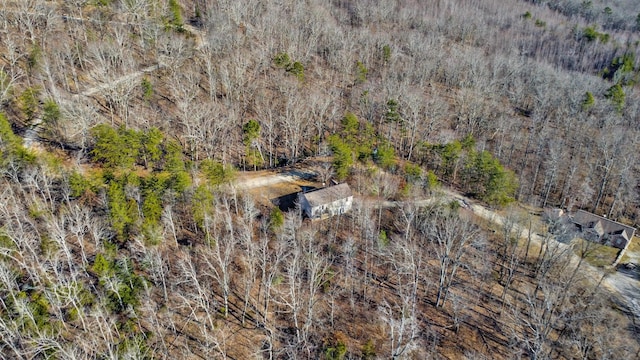 birds eye view of property with a view of trees