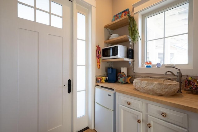 doorway featuring a sink