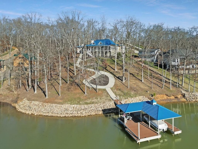 dock area with a water view and boat lift