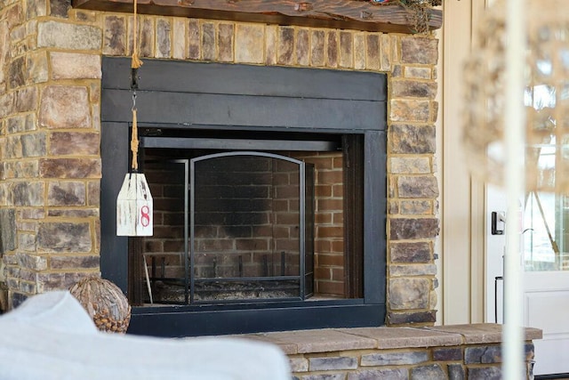 details featuring a brick fireplace