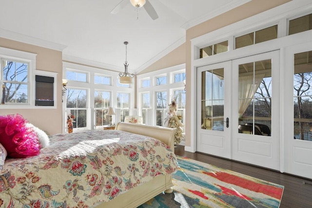 bedroom with access to exterior, vaulted ceiling, french doors, ornamental molding, and dark wood finished floors