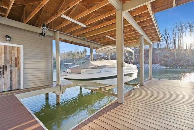 dock area with a water view and boat lift