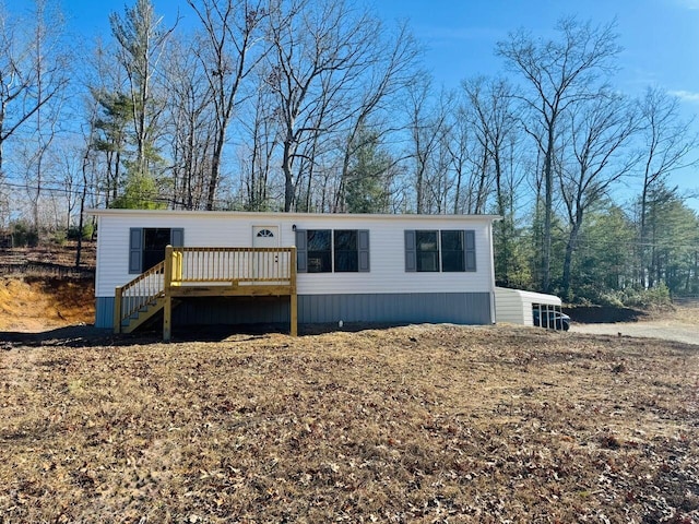 manufactured / mobile home with a wooden deck