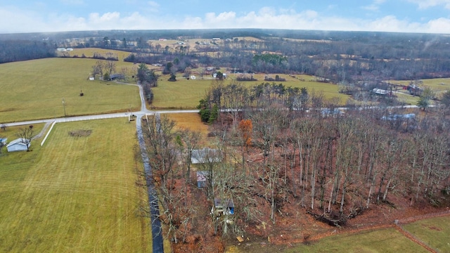 birds eye view of property with a rural view