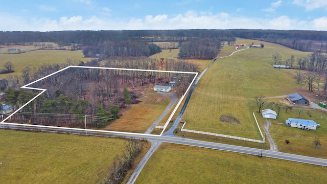 birds eye view of property featuring a rural view