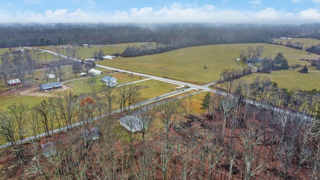 birds eye view of property with a rural view