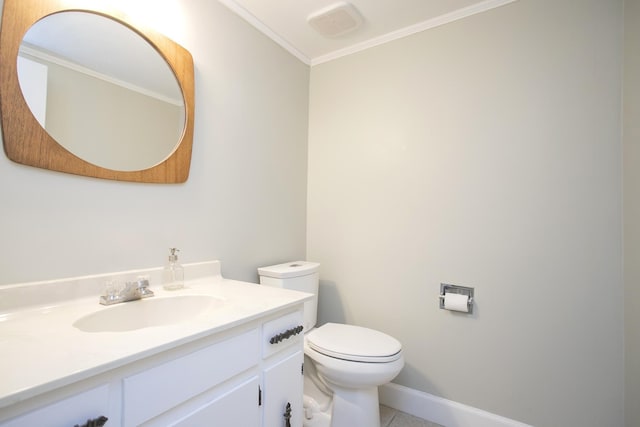 bathroom featuring visible vents, toilet, vanity, baseboards, and tile patterned floors