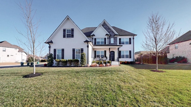 view of front facade featuring a front yard and stucco siding