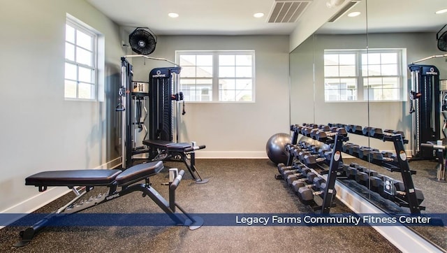 exercise room with recessed lighting, visible vents, and baseboards