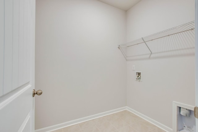 washroom featuring laundry area, washer hookup, and baseboards