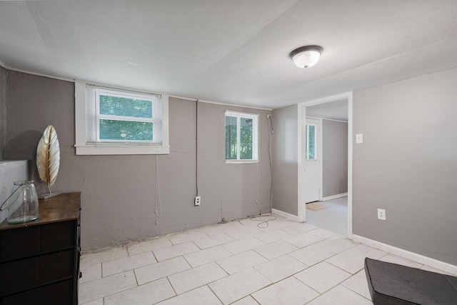 spare room featuring baseboards