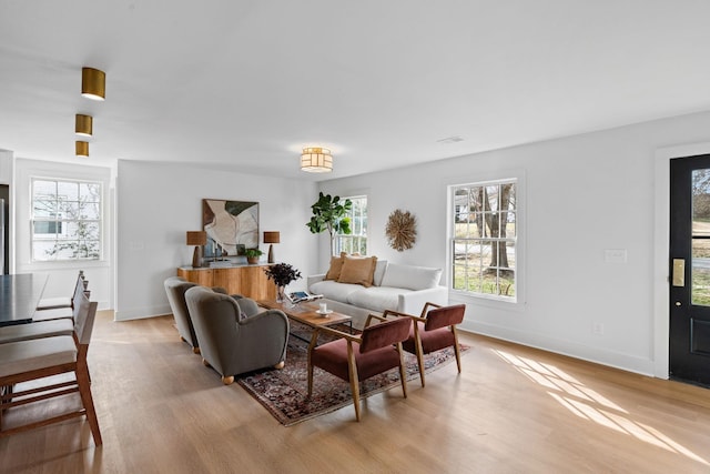 living room with light wood-style floors and baseboards