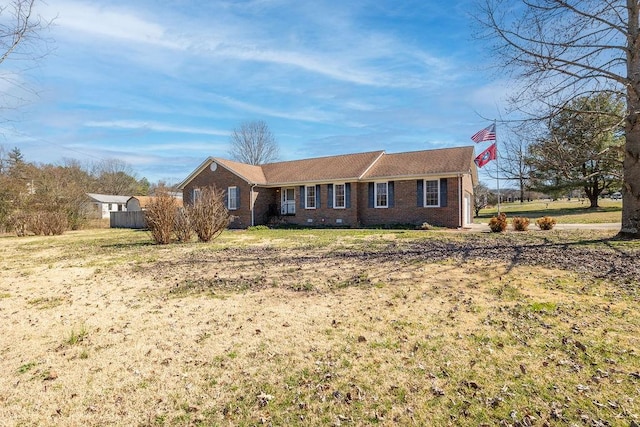 ranch-style house with brick siding, crawl space, and a front yard