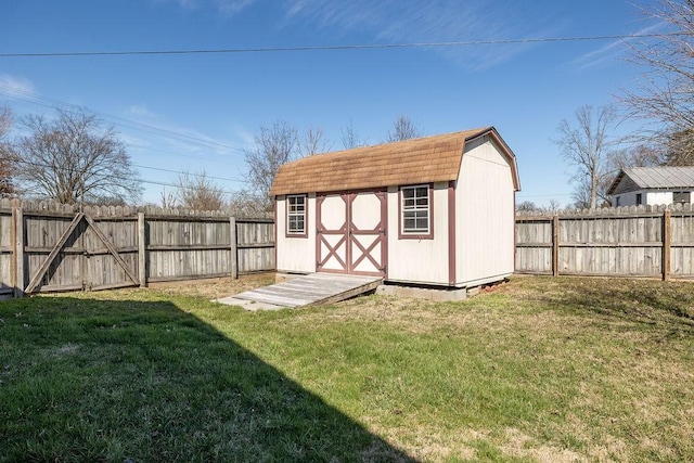 view of shed with a fenced backyard