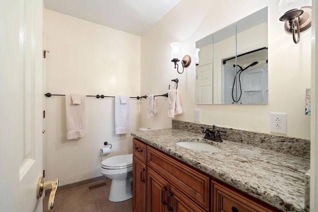 full bath with visible vents, toilet, vanity, baseboards, and tile patterned floors