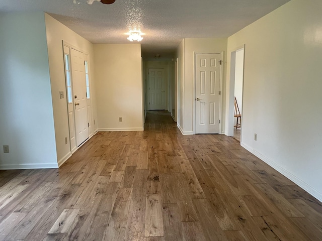 1669 Cornersville Hwy, Lewisburg, TN 37091 - interior space featuring baseboards, a textured ceiling, and wood finished floors