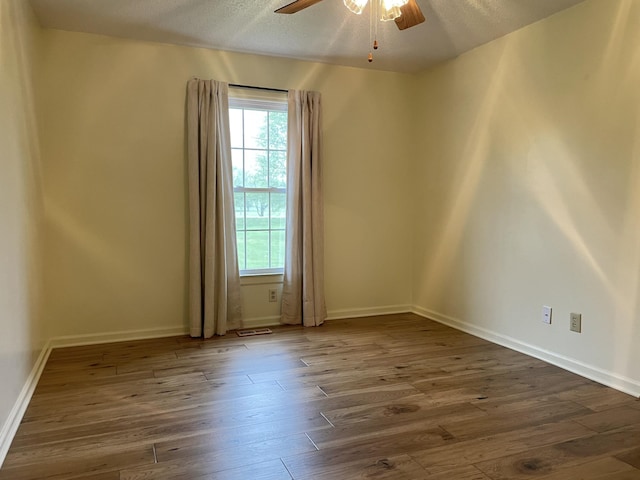 1669 Cornersville Hwy, Lewisburg, TN 37091 - unfurnished room featuring plenty of natural light, dark wood-type flooring, baseboards, and ceiling fan