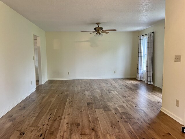 1669 Cornersville Hwy, Lewisburg, TN 37091 - unfurnished room with baseboards, a ceiling fan, a textured ceiling, and hardwood / wood-style floors