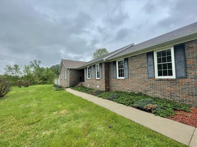 1669 Cornersville Hwy, Lewisburg, TN 37091 - view of side of home featuring a lawn and brick siding