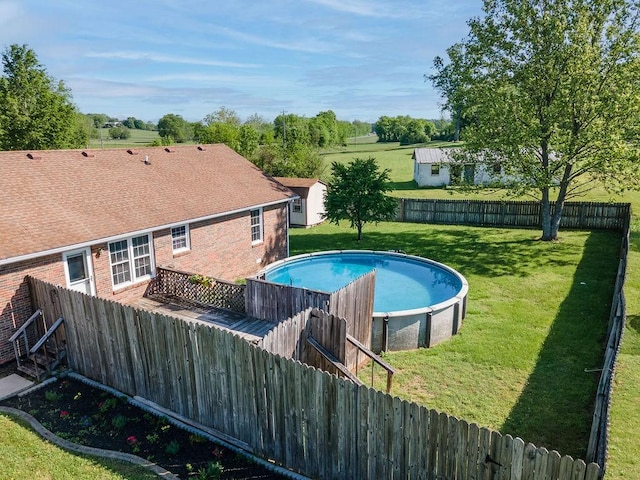 1669 Cornersville Hwy, Lewisburg, TN 37091 - view of swimming pool with a lawn, an outdoor structure, a shed, and a fenced backyard
