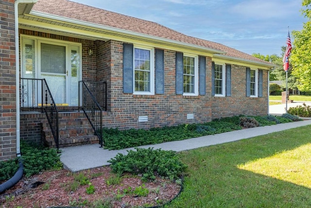 1669 Cornersville Hwy, Lewisburg, TN 37091 - exterior space featuring a shingled roof, a yard, and brick siding