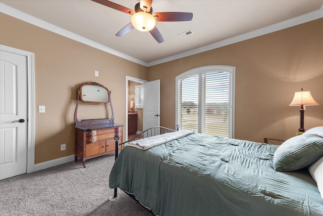 bedroom featuring baseboards, visible vents, a ceiling fan, light colored carpet, and crown molding