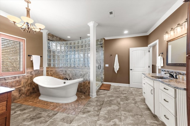 full bath with tile walls, a soaking tub, visible vents, a stall shower, and vanity