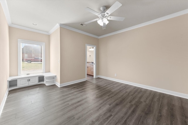 unfurnished bedroom featuring dark wood-type flooring, a ceiling fan, baseboards, visible vents, and crown molding