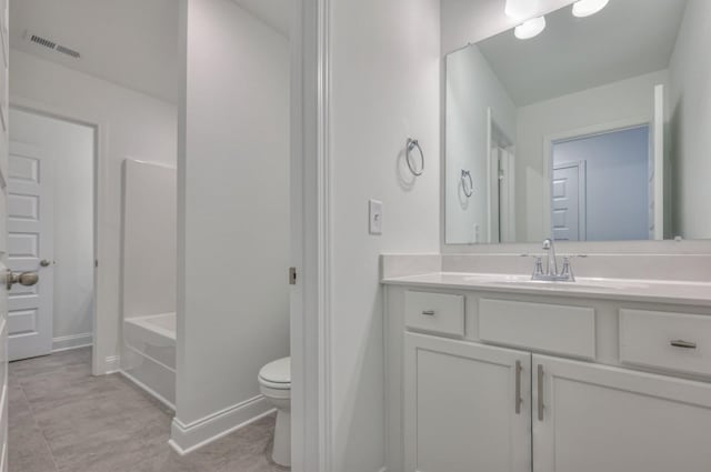 bathroom with baseboards, visible vents, toilet, tile patterned flooring, and vanity