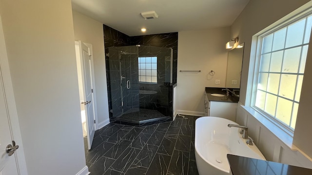 full bathroom featuring marble look tiles, baseboards, a stall shower, and vanity