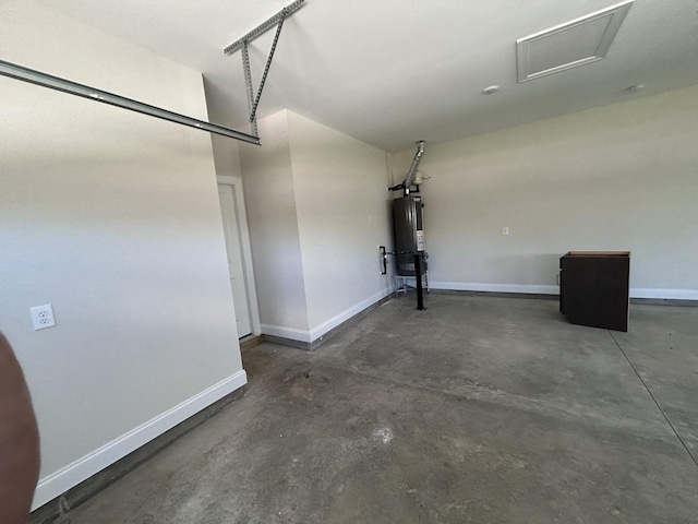 garage featuring water heater and baseboards