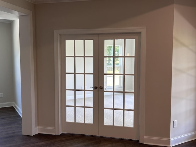 doorway featuring french doors, baseboards, dark wood-style floors, and crown molding