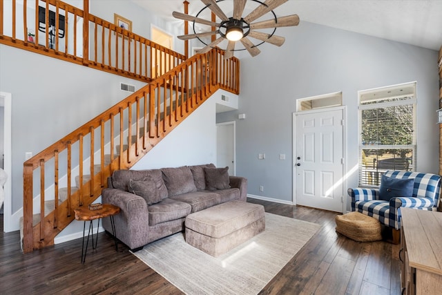 living area with wood-type flooring, stairs, baseboards, and visible vents