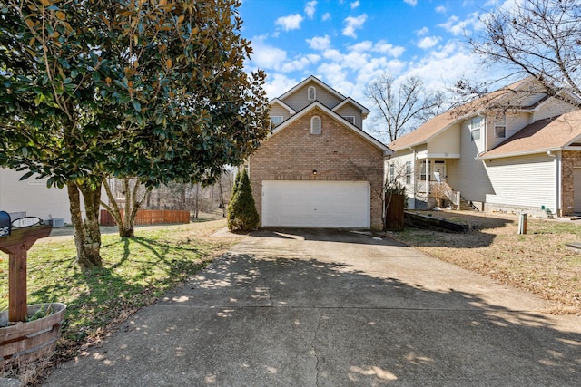 view of front of house featuring an outbuilding, concrete driveway, and brick siding