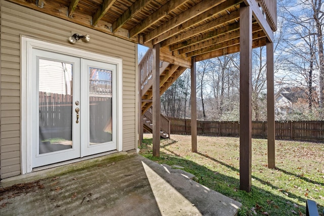 view of patio with fence, stairway, and french doors